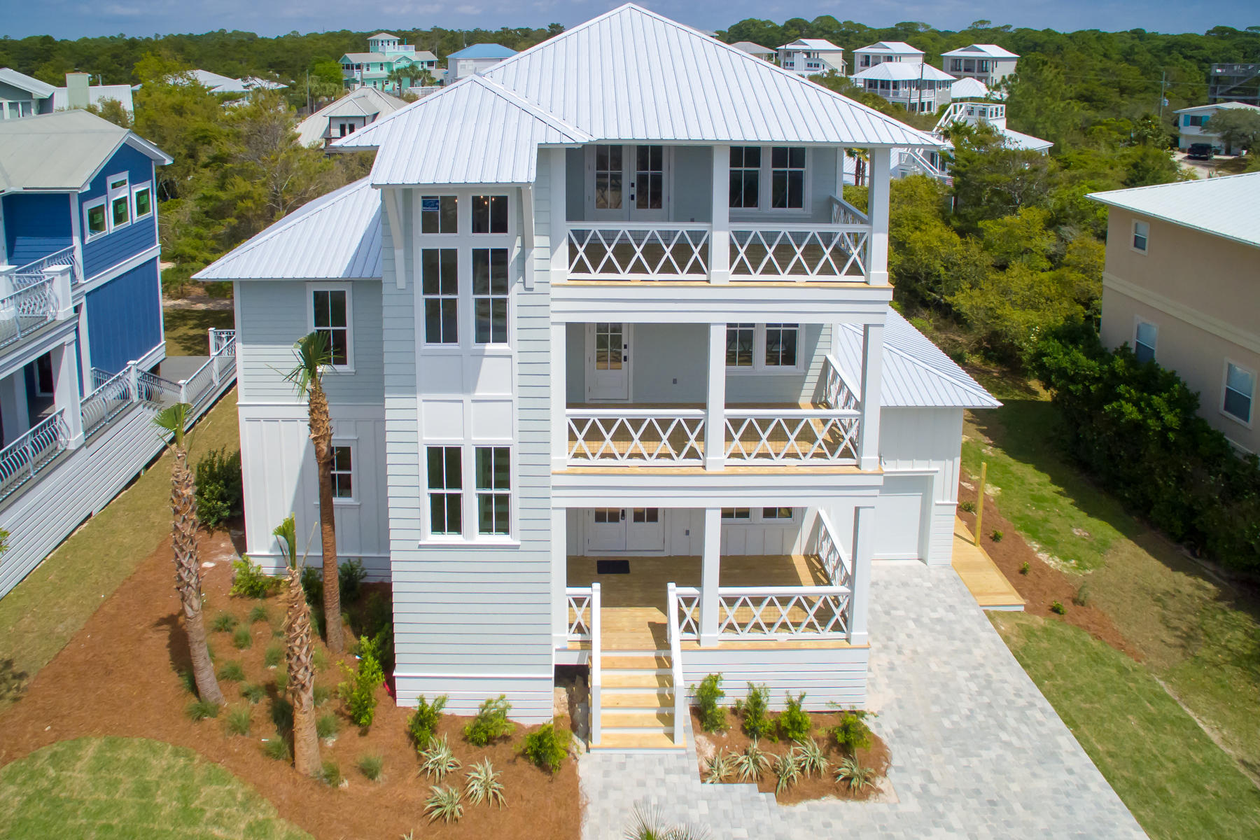 68 Baird Road Santa Rosa Beach, FL 32459 - Photo 1 of 30 a front view of a house with a garden
