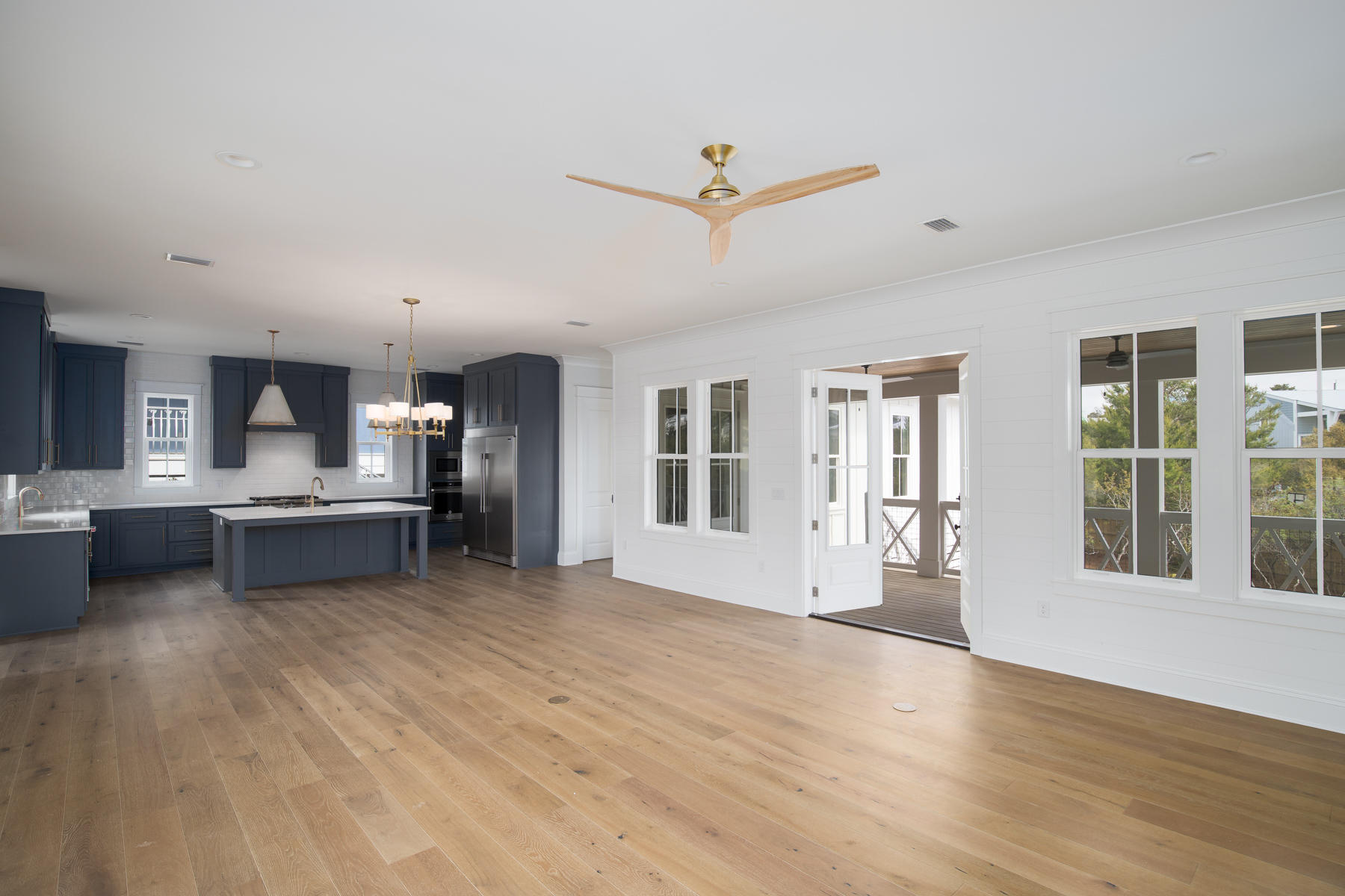68 Baird Road Santa Rosa Beach, FL 32459 - Photo 30 of 30 a living room with stainless steel appliances kitchen island hardwood floor and a kitchen