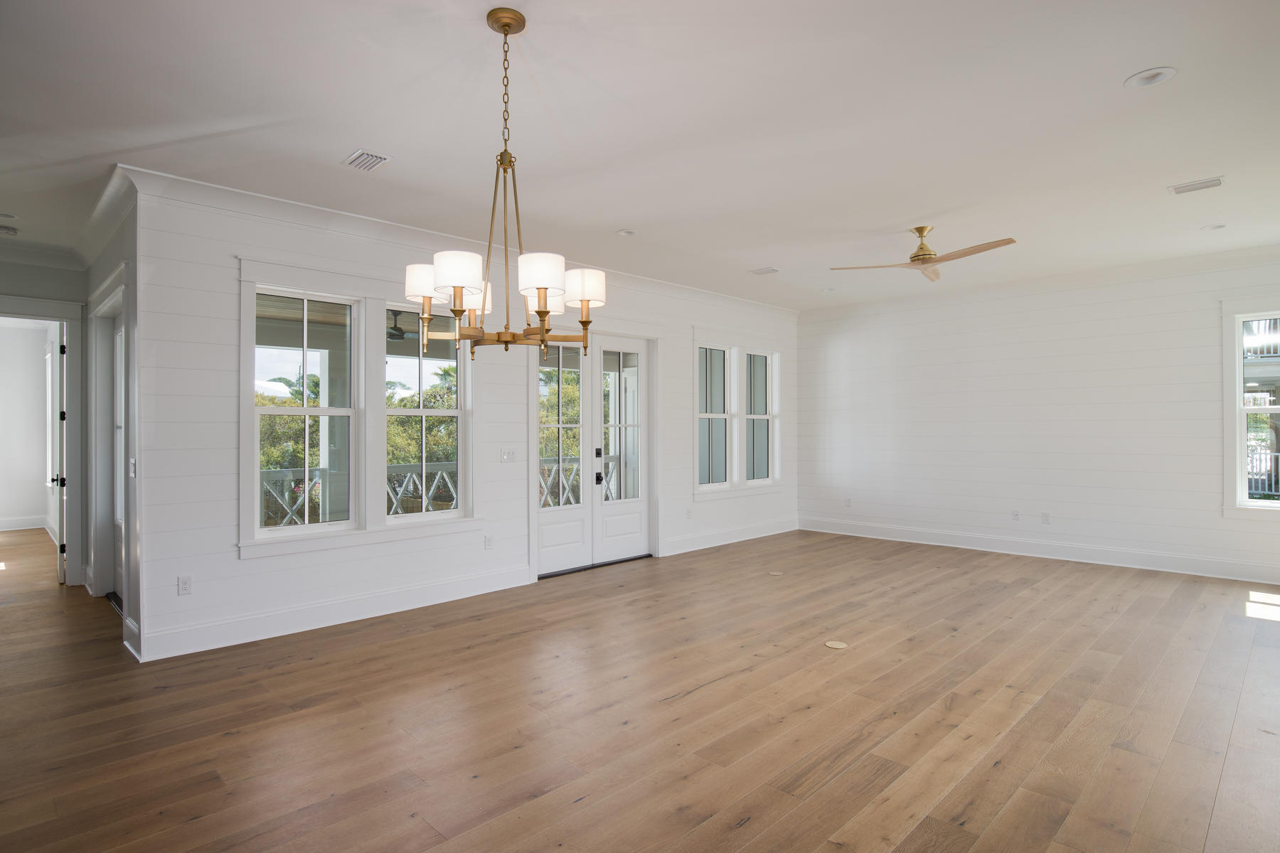 68 Baird Road Santa Rosa Beach, FL 32459 - Photo 8 of 30 a view of an empty room with wooden floor and a window