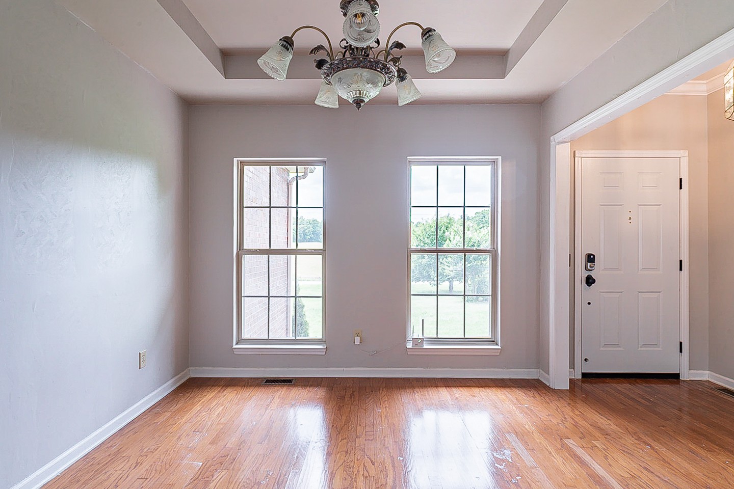 227 Beckwith Road Mount Juliet, TN 37122 - Photo 12 of 34 a view of an empty room with wooden floor and a window