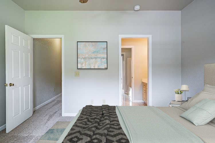 227 Beckwith Road Mount Juliet, TN 37122 - Photo 3 of 34 a bedroom with a bed and a painting on the wall