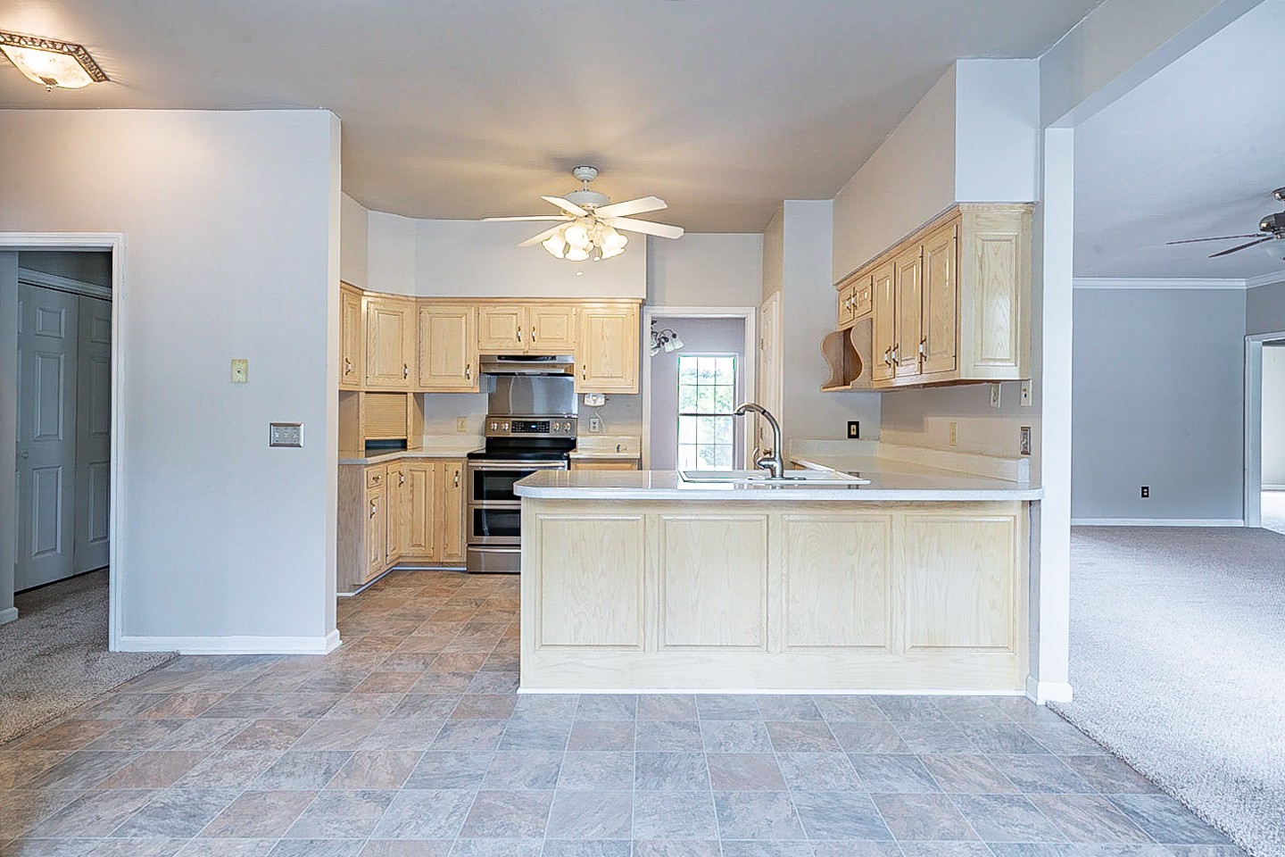 227 Beckwith Road Mount Juliet, TN 37122 - Photo 4 of 34 a large kitchen with cabinets and stainless steel appliances