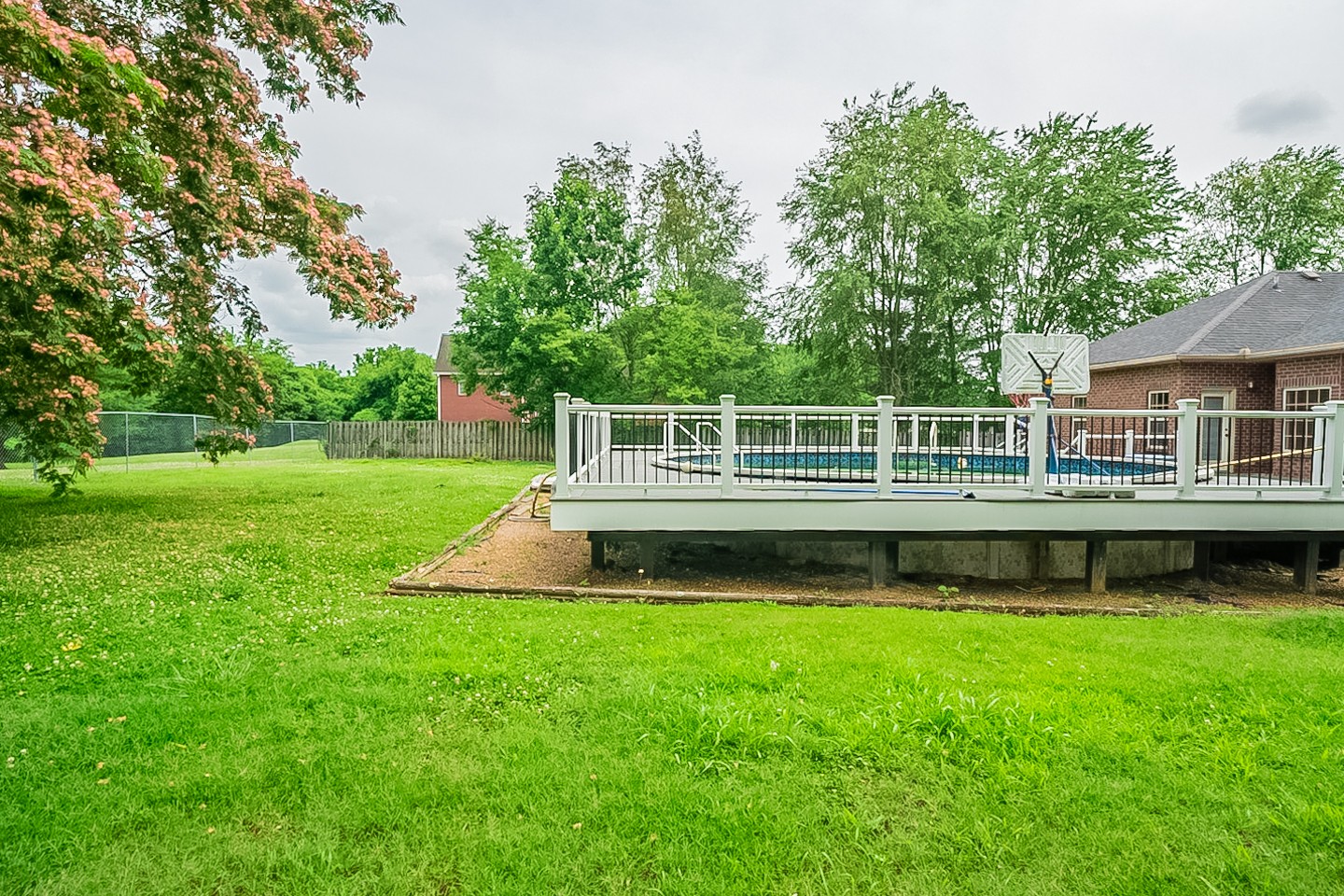 227 Beckwith Road Mount Juliet, TN 37122 - Photo 33 of 34 a view of a house with a wooden deck and a big yard