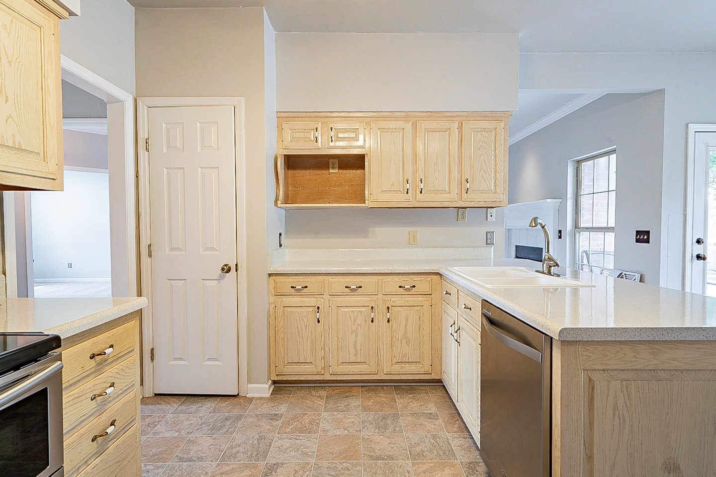227 Beckwith Road Mount Juliet, TN 37122 - Photo 9 of 34 a kitchen with stainless steel appliances granite countertop a sink and dishwasher with white cabinets