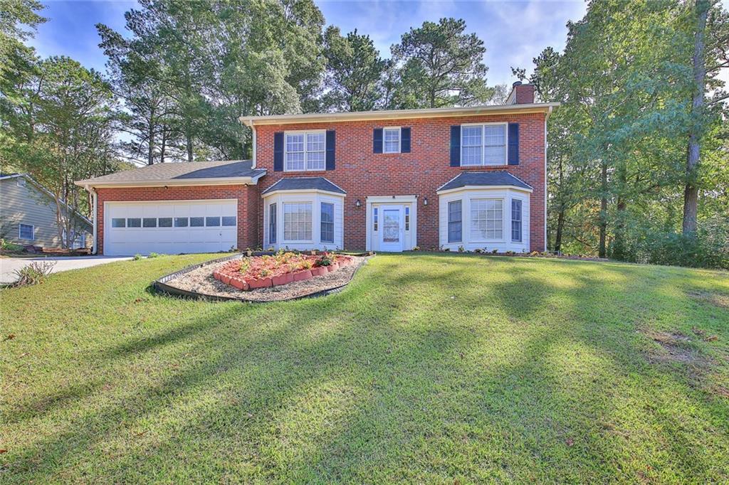 161 Muddy River Road Lawrenceville, GA 30043 - Photo 1 of 1 a front view of a house with garden