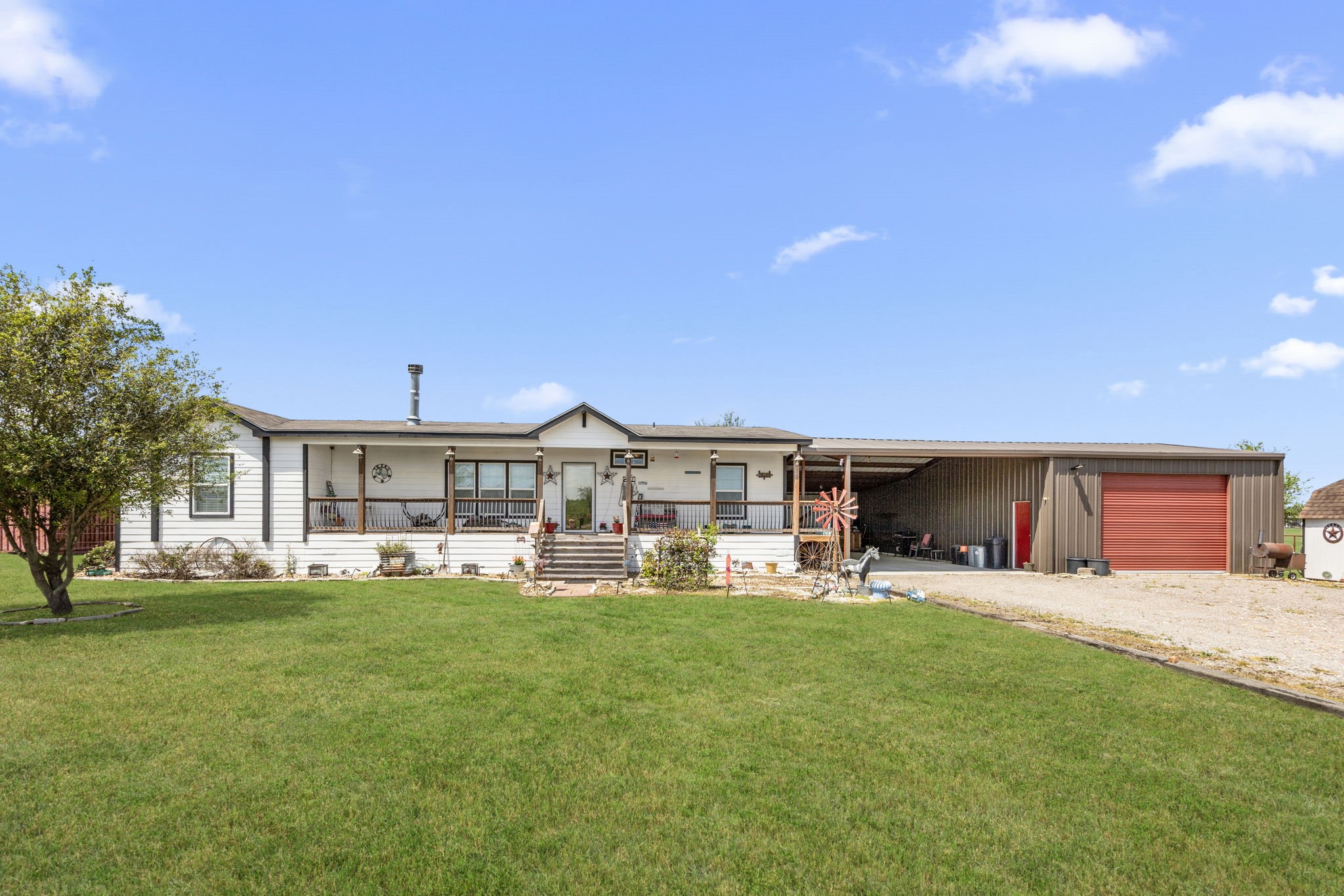 3518 Oil Field Road Bellville, TX 77418 - Photo 1 of 40 a view of a house with a yard and sitting area