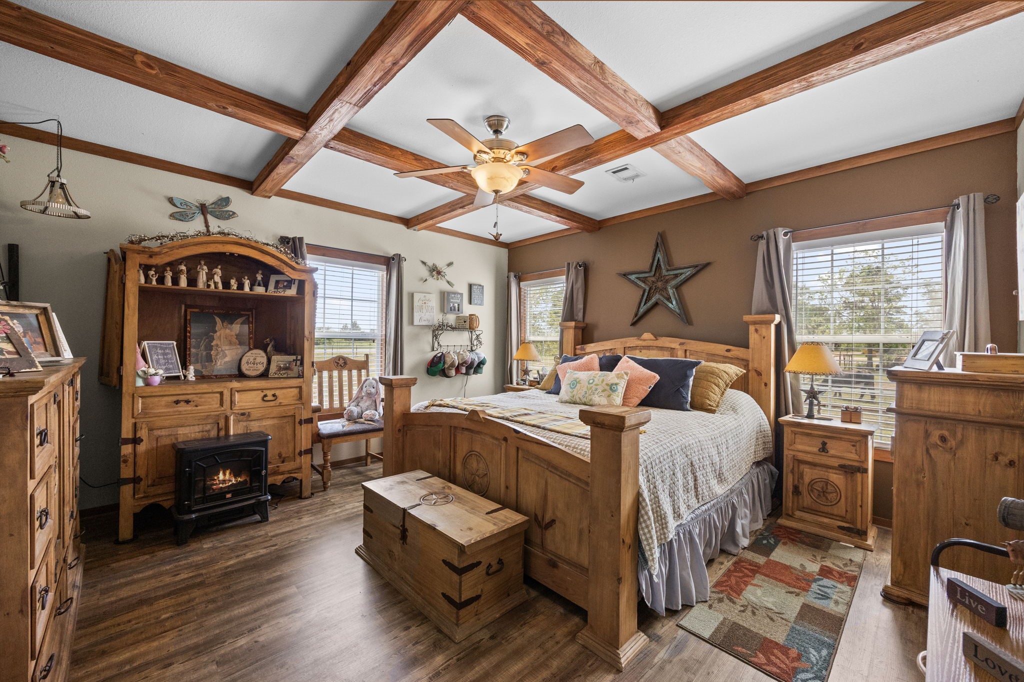 3518 Oil Field Road Bellville, TX 77418 - Photo 15 of 40 a bed room with furniture and a fireplace