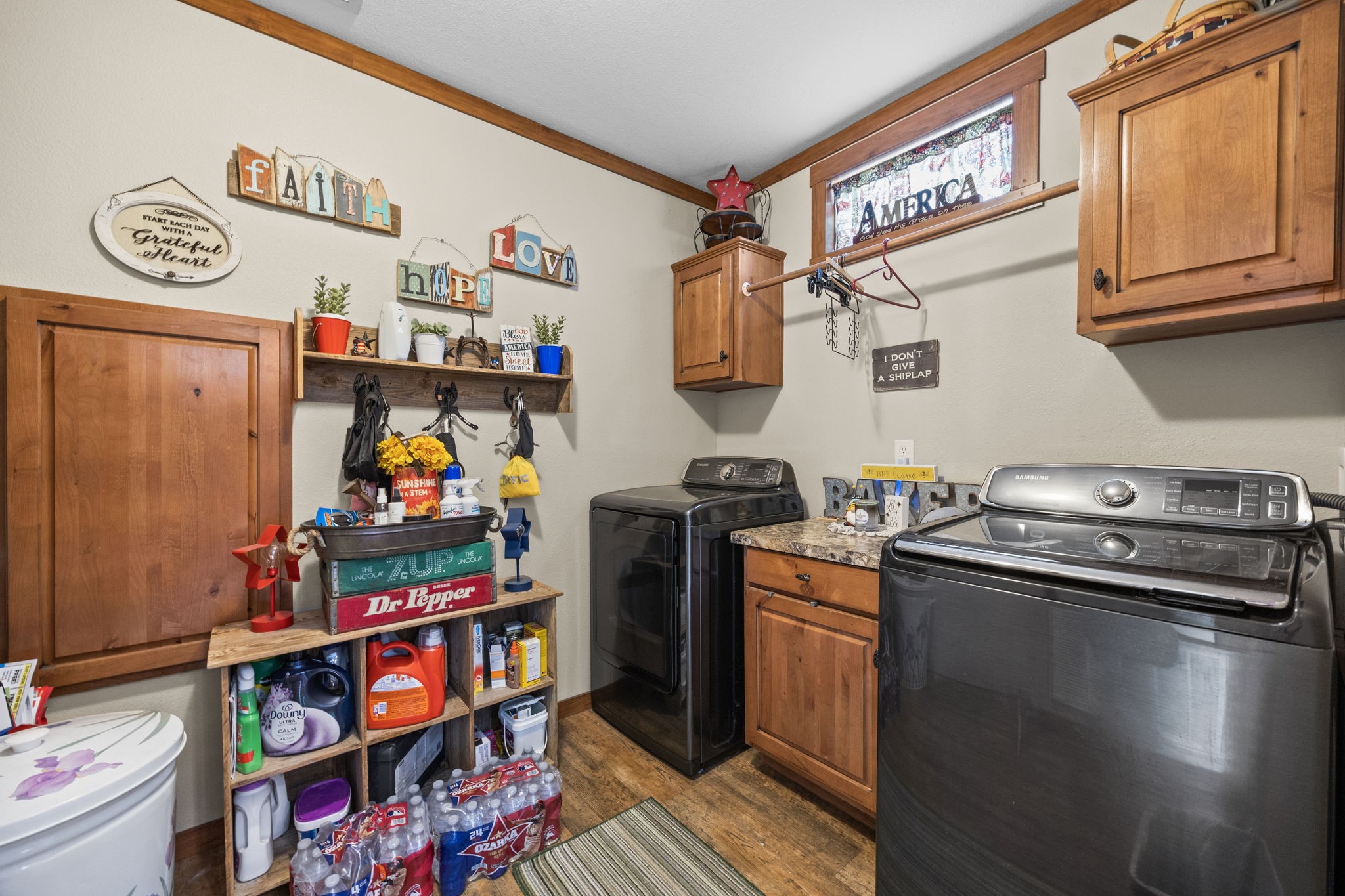 3518 Oil Field Road Bellville, TX 77418 - Photo 19 of 40 a kitchen with stainless steel appliances granite countertop a stove a microwave and a refrigerator