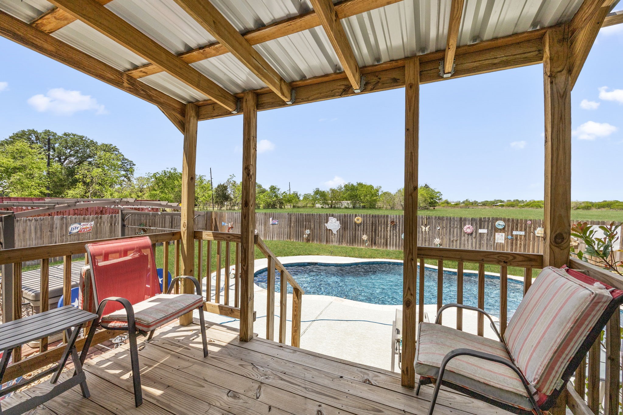 3518 Oil Field Road Bellville, TX 77418 - Photo 23 of 40 a view of a chairs and table in the roof deck