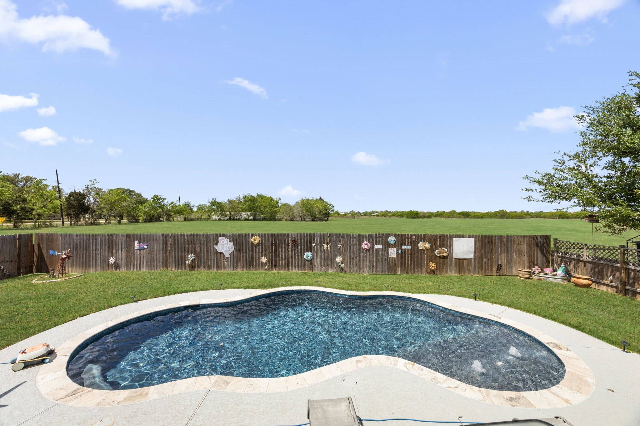3518 Oil Field Road Bellville, TX 77418 - Photo 25 of 40 a view of a swimming pool with a lake view