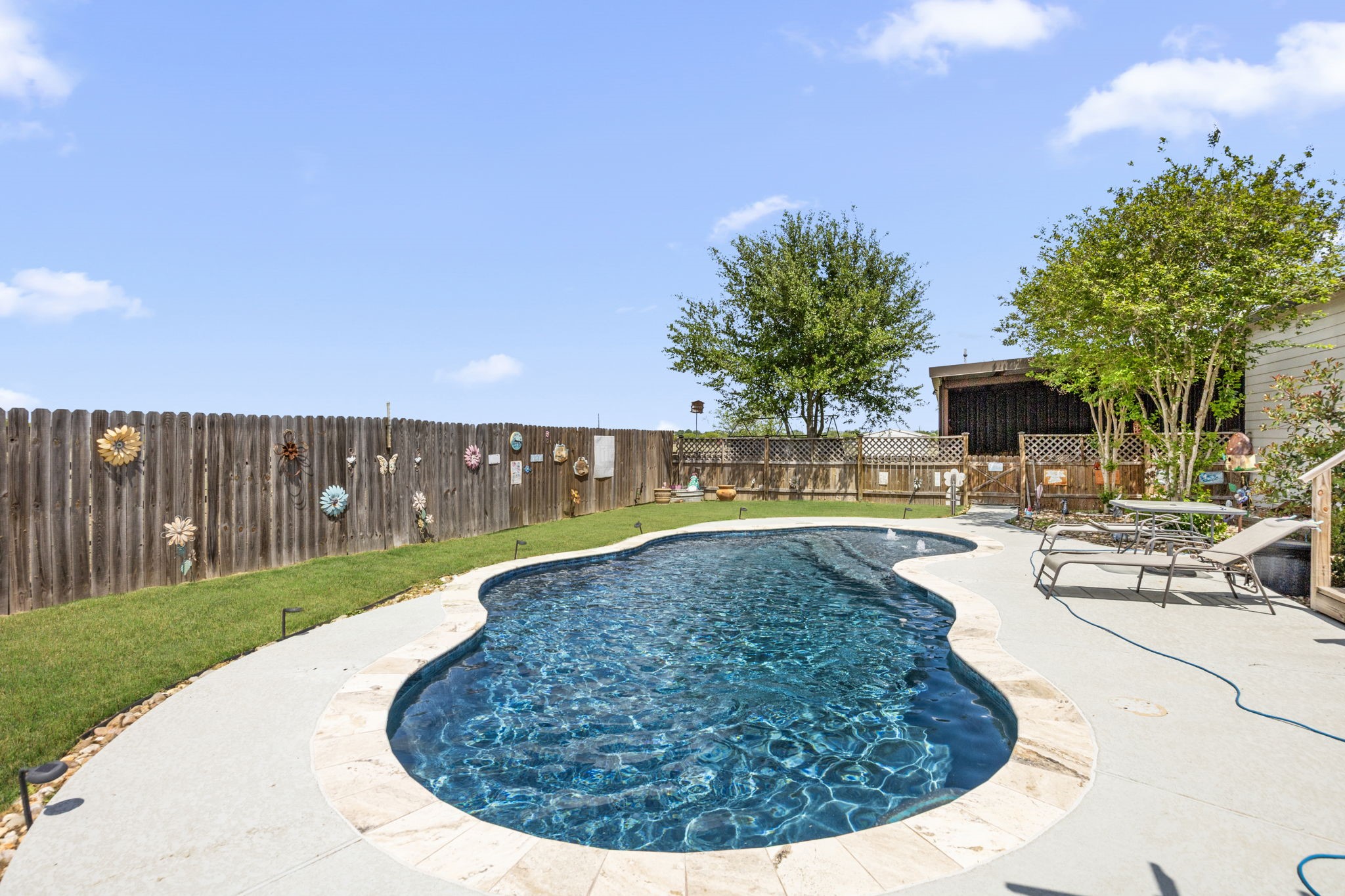 3518 Oil Field Road Bellville, TX 77418 - Photo 26 of 40 a view of a swimming pool with a yard