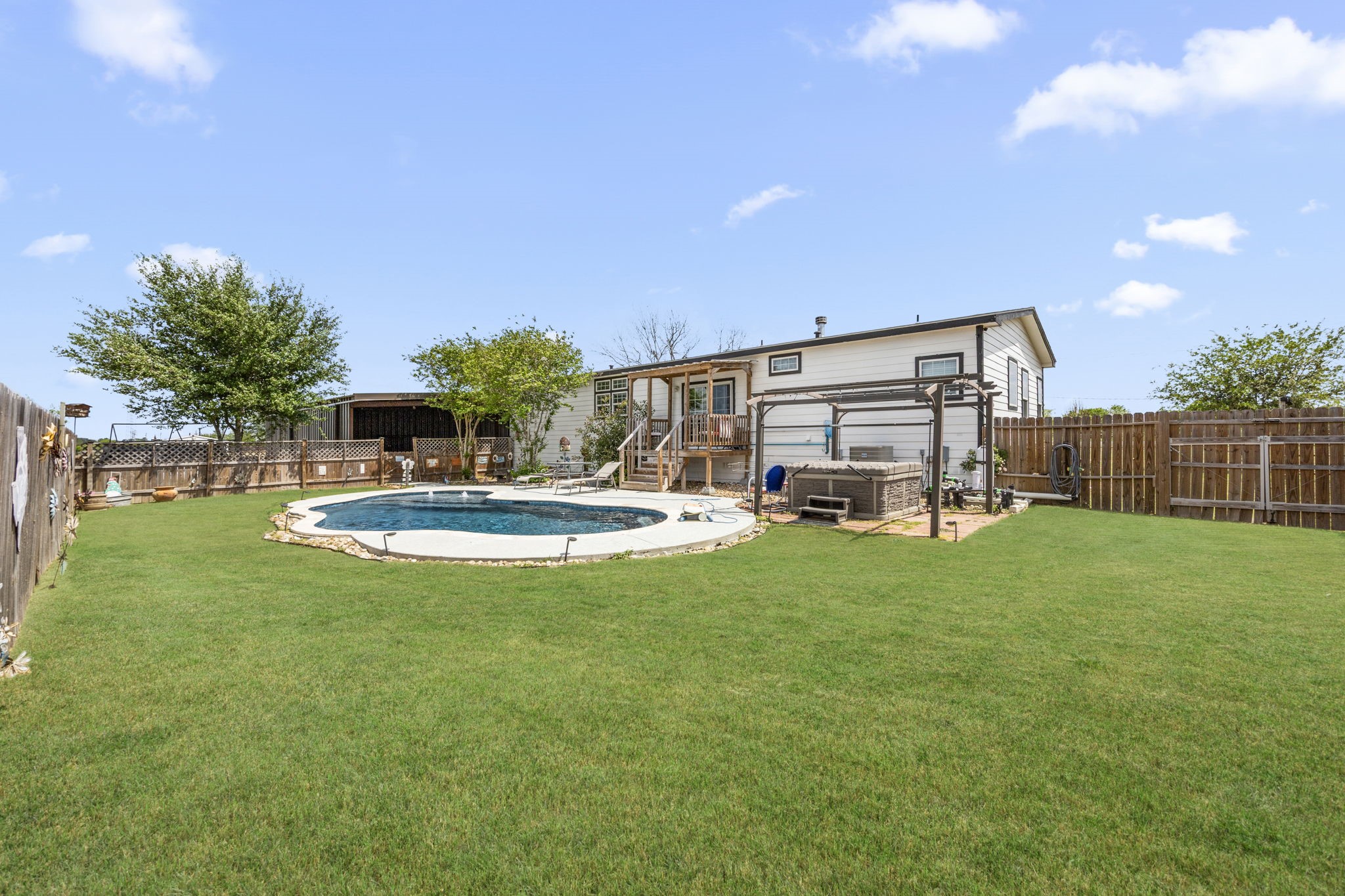 3518 Oil Field Road Bellville, TX 77418 - Photo 27 of 40 a view of a house with backyard and sitting area