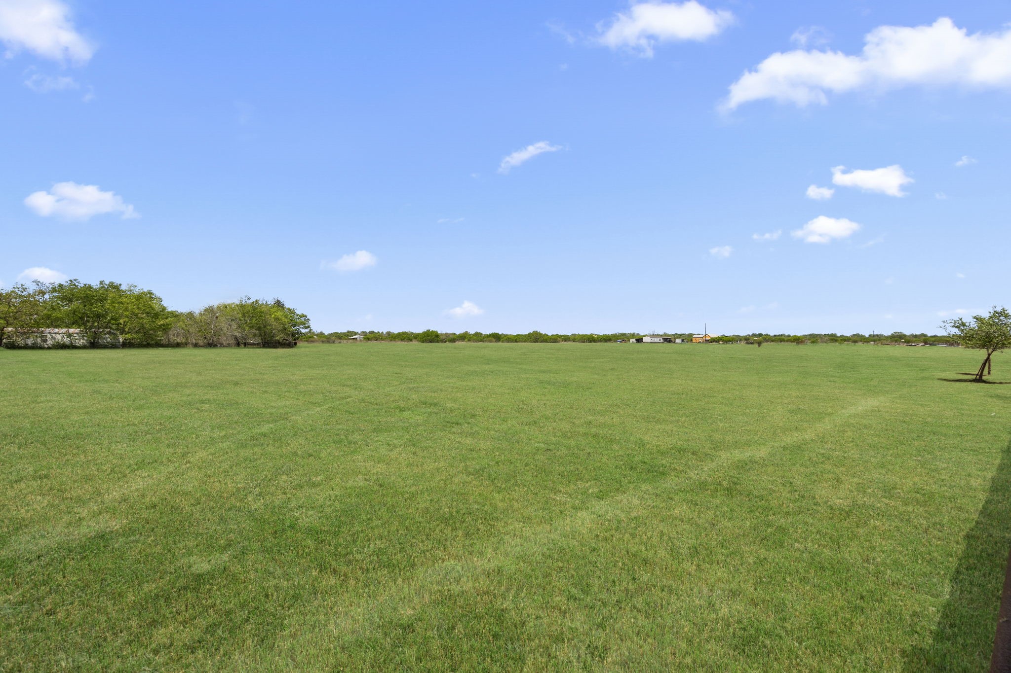3518 Oil Field Road Bellville, TX 77418 - Photo 30 of 40 a view of an ocean and a yard