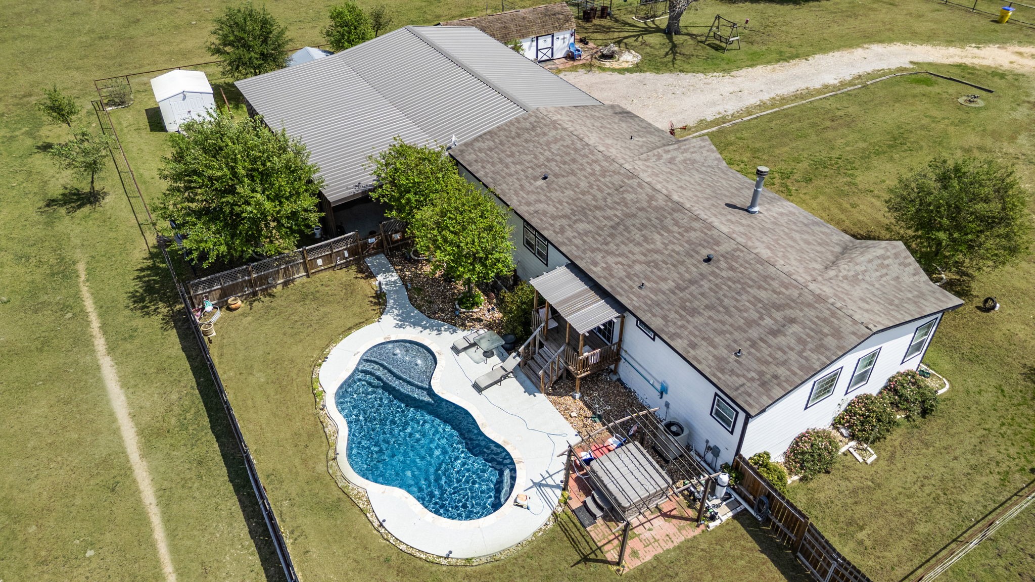 3518 Oil Field Road Bellville, TX 77418 - Photo 37 of 40 an aerial view of a house with swimming pool
