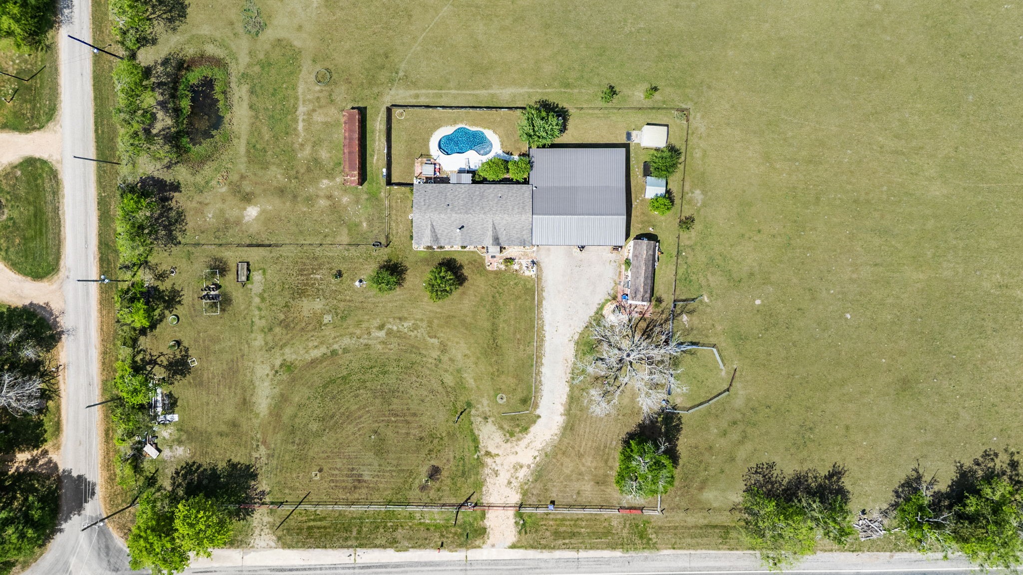 3518 Oil Field Road Bellville, TX 77418 - Photo 38 of 40 an aerial view of a house with a yard