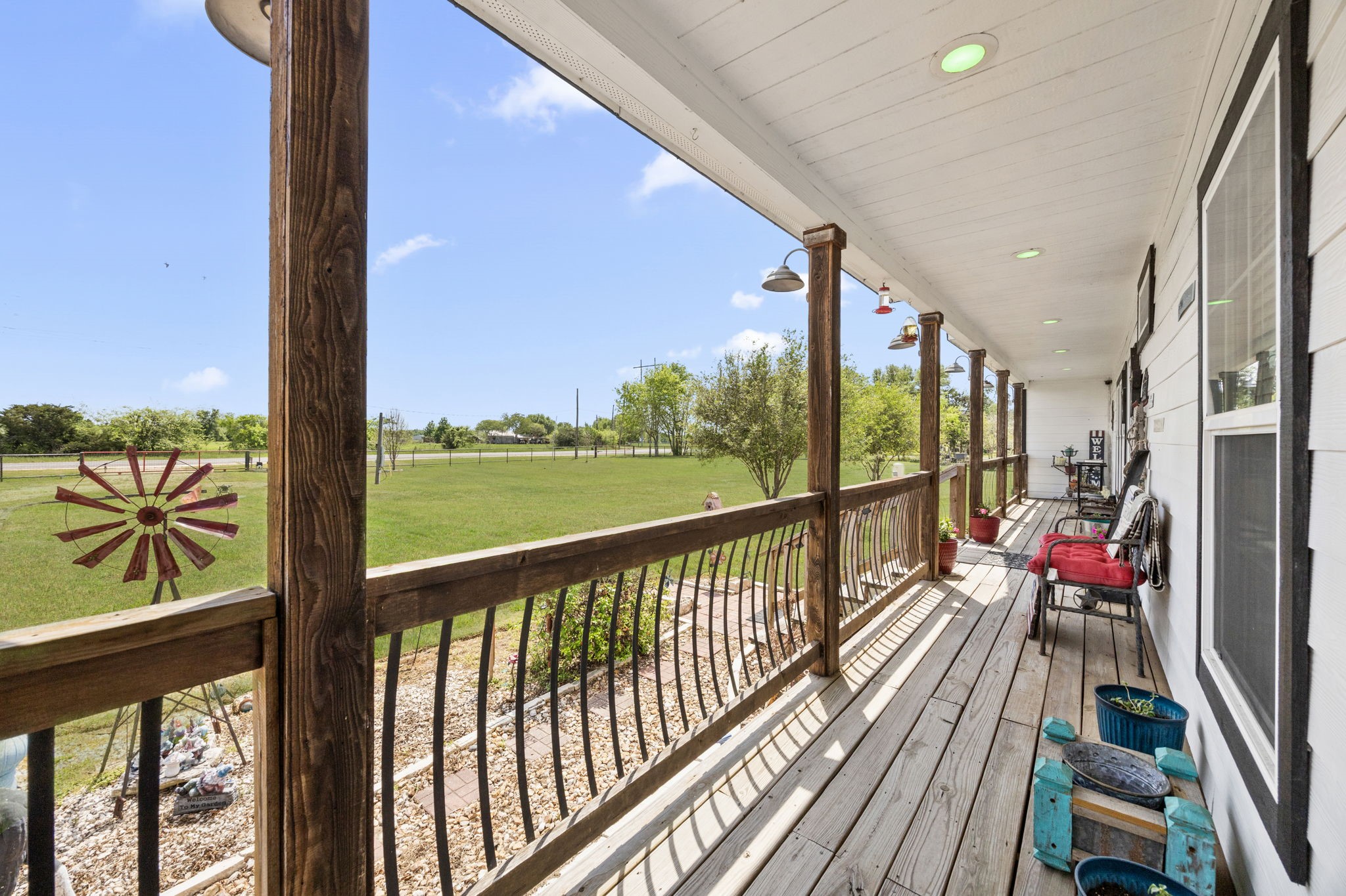 3518 Oil Field Road Bellville, TX 77418 - Photo 6 of 40 a view of two chairs in balcony with wooden floor