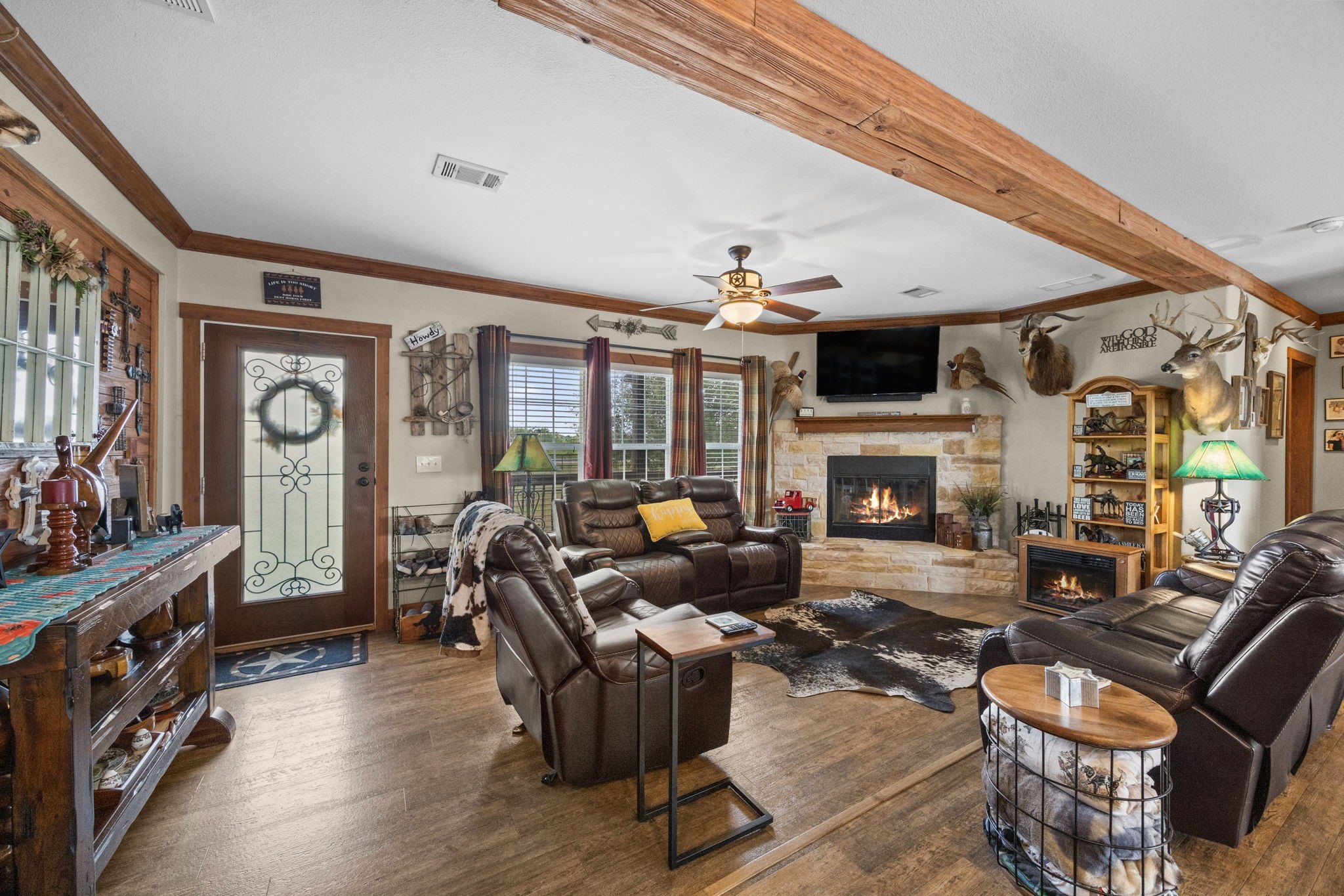 3518 Oil Field Road Bellville, TX 77418 - Photo 8 of 40 a living room with fireplace furniture and a flat screen tv