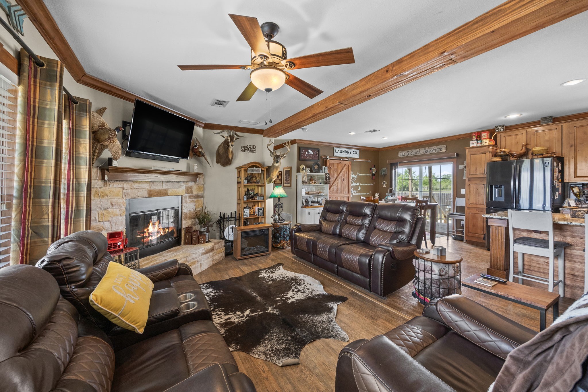 3518 Oil Field Road Bellville, TX 77418 - Photo 9 of 40 a living room with furniture fireplace and flat screen tv