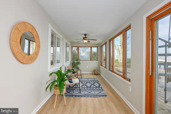 a living room with patio bathtub and a window