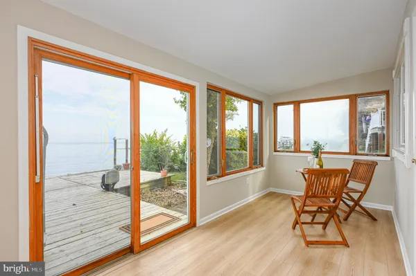 a wooden bench sitting next to a lake