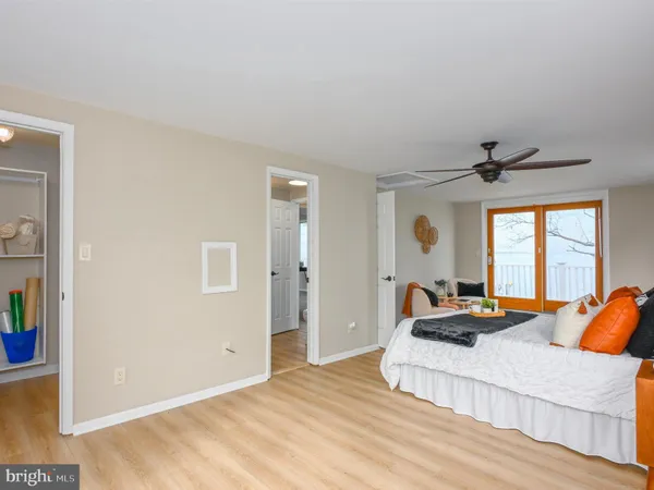 a bedroom with furniture and a window