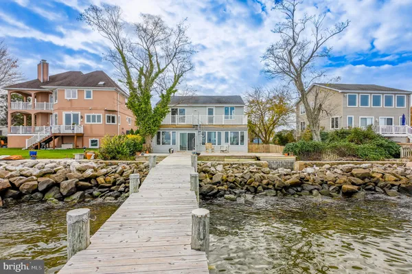 a front view of a house with a ocean view