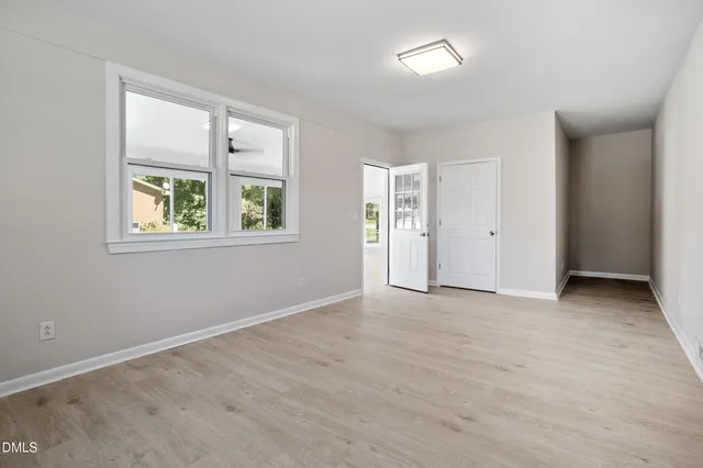 an empty room with windows