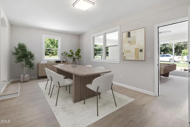 a dining room with furniture and window