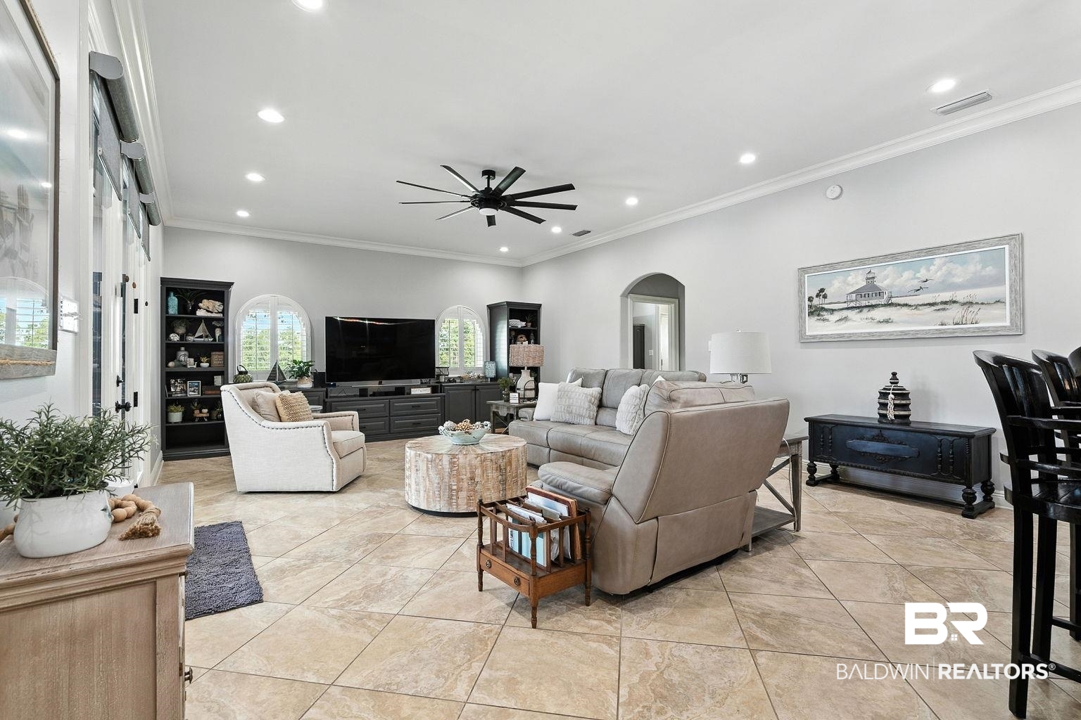 23357 Carnoustie Drive Foley, AL 36535 - Photo 17 of 99 Living area with ornamental molding, arched walkways, light tile patterned flooring, recessed lighting, and a ceiling fan