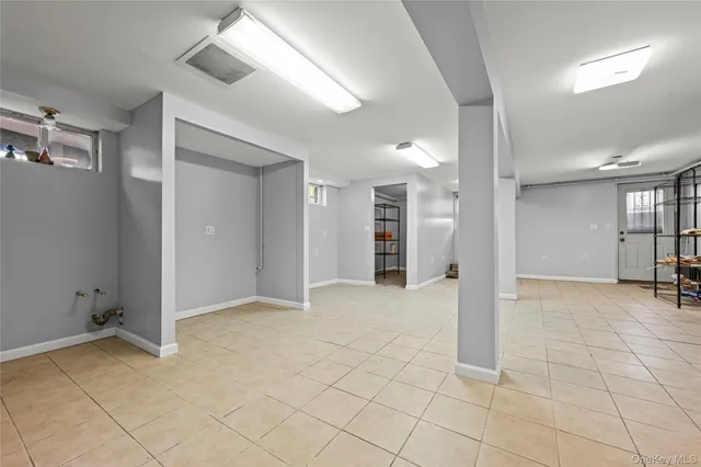 a bathroom with a granite countertop bathtub shower sink vanity and toilet