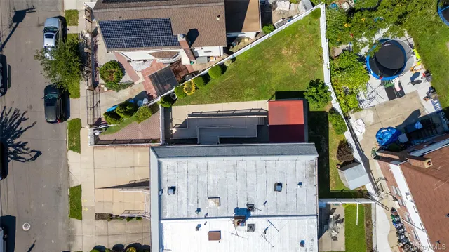 an aerial view of houses with yard
