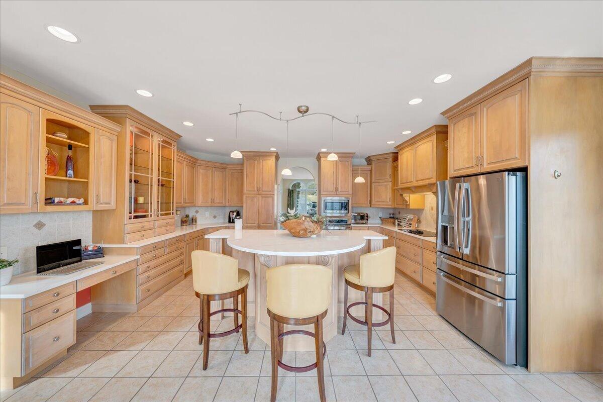 2580 Lakewood Forest Road Moneta, VA 24121 - Photo 18 of 103 a kitchen with stainless steel appliances kitchen island granite countertop a refrigerator a stove a sink and white cabinets with wooden floor