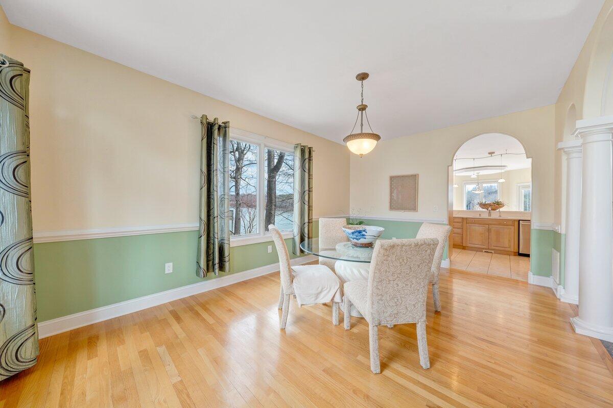 2580 Lakewood Forest Road Moneta, VA 24121 - Photo 39 of 103 a view of a dining room with furniture window and wooden floor
