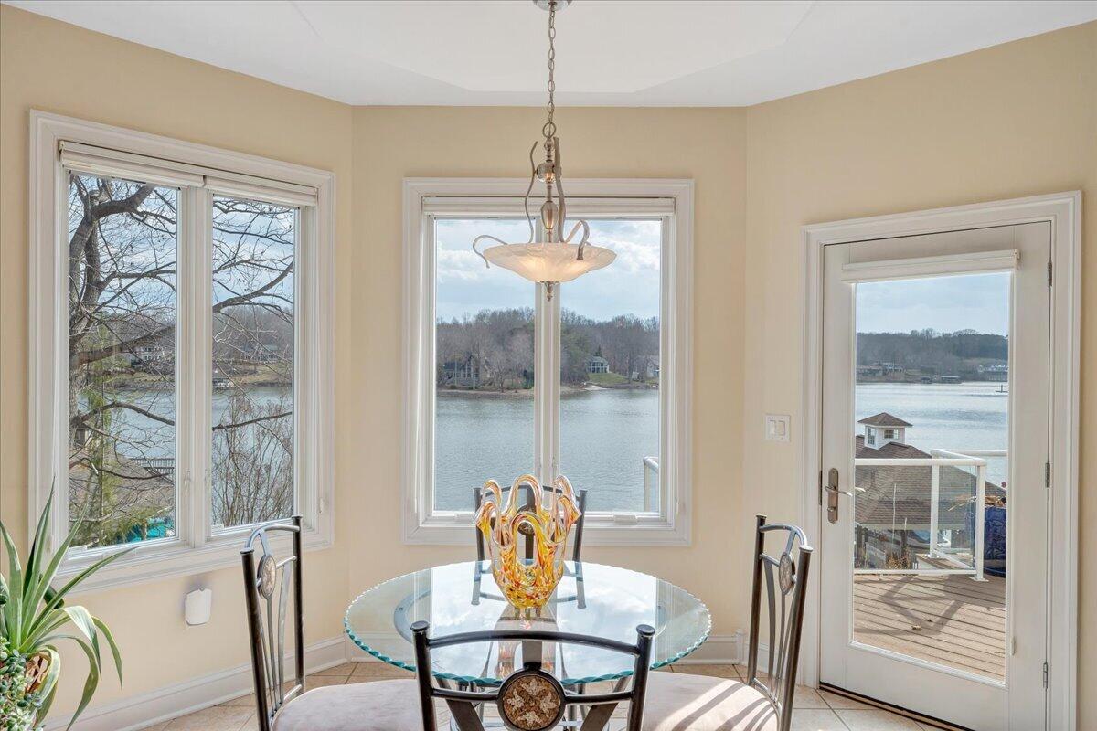 2580 Lakewood Forest Road Moneta, VA 24121 - Photo 42 of 103 a dining room with furniture a chandelier and window