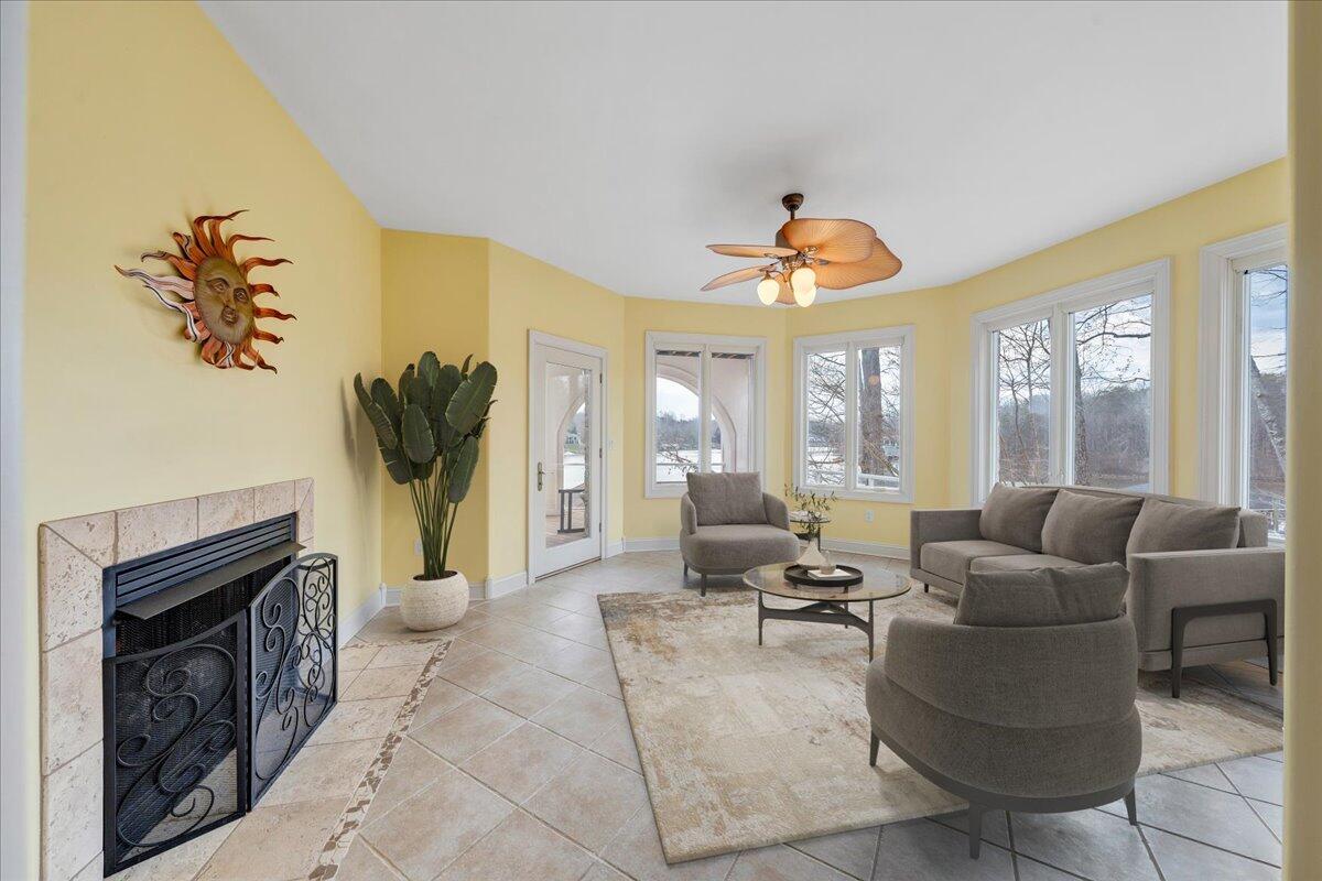 2580 Lakewood Forest Road Moneta, VA 24121 - Photo 44 of 103 a living room with furniture a fireplace and a large window