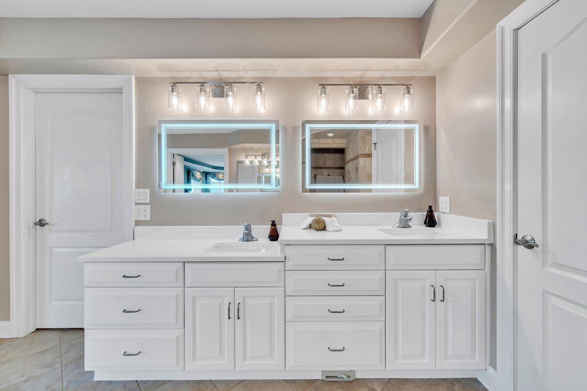 2580 Lakewood Forest Road Moneta, VA 24121 - Photo 59 of 103 a bathroom with a double vanity sink and mirror