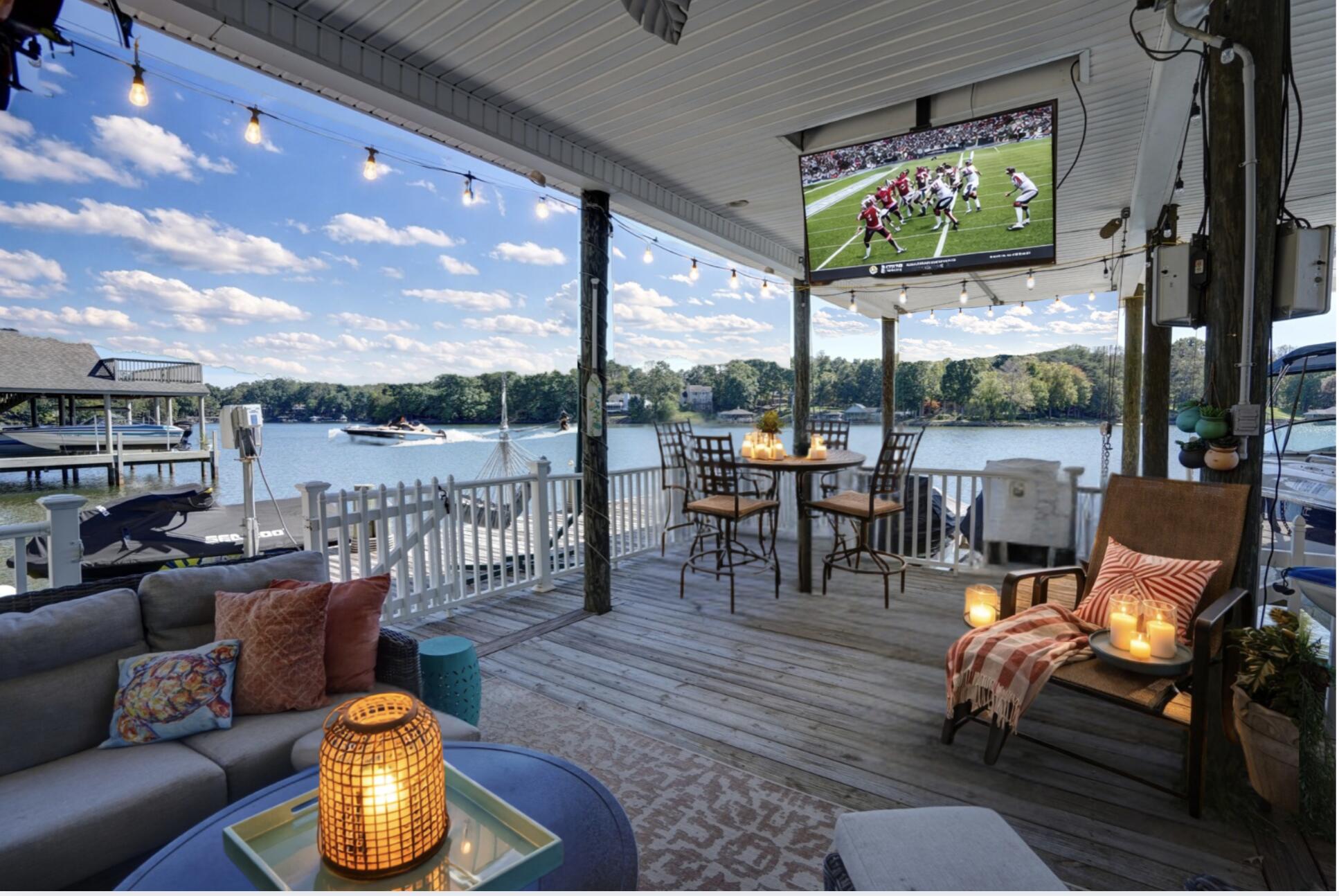 2580 Lakewood Forest Road Moneta, VA 24121 - Photo 6 of 103 a balcony with furniture and a floor to ceiling window
