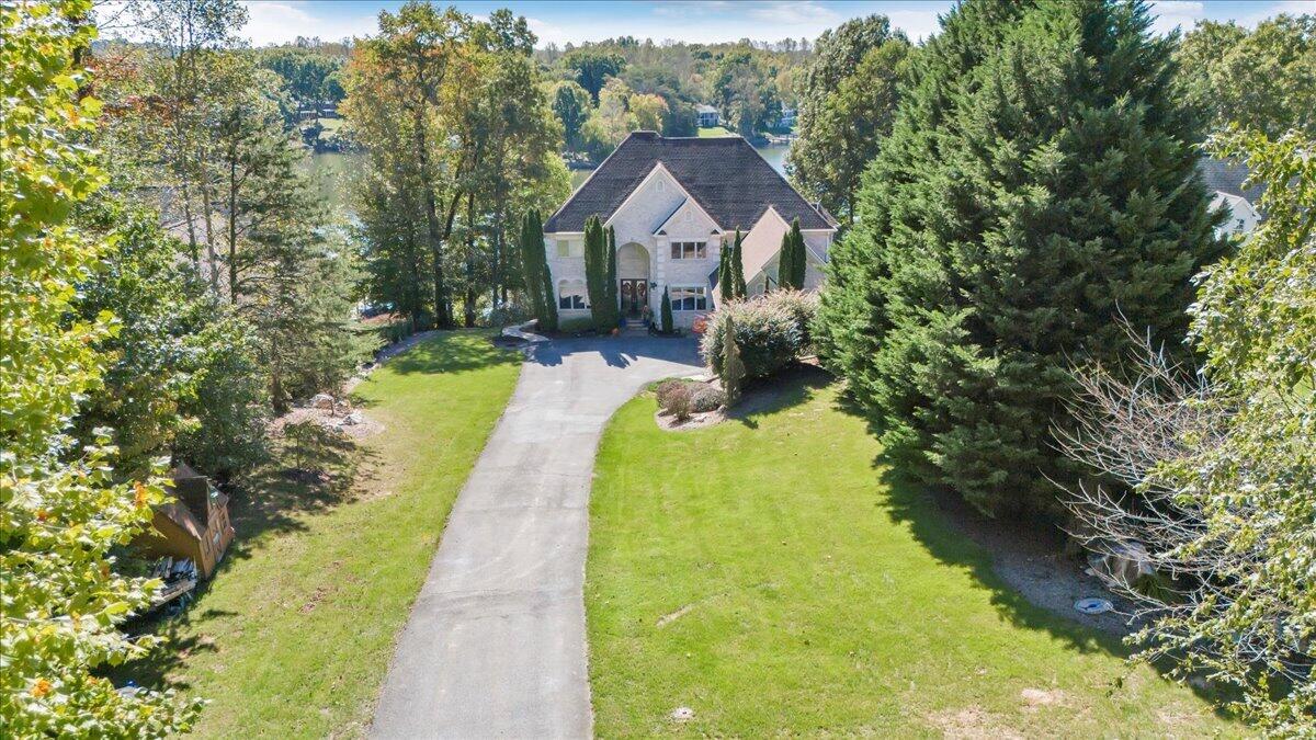 2580 Lakewood Forest Road Moneta, VA 24121 - Photo 91 of 103 a view of house with garden space and trees