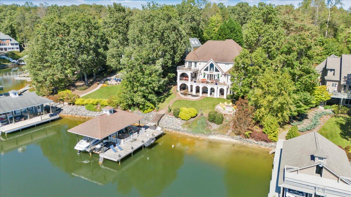 2580 Lakewood Forest Road Moneta, VA 24121 - Photo 94 of 103 an aerial view of a house with a swimming pool outdoor seating and yard