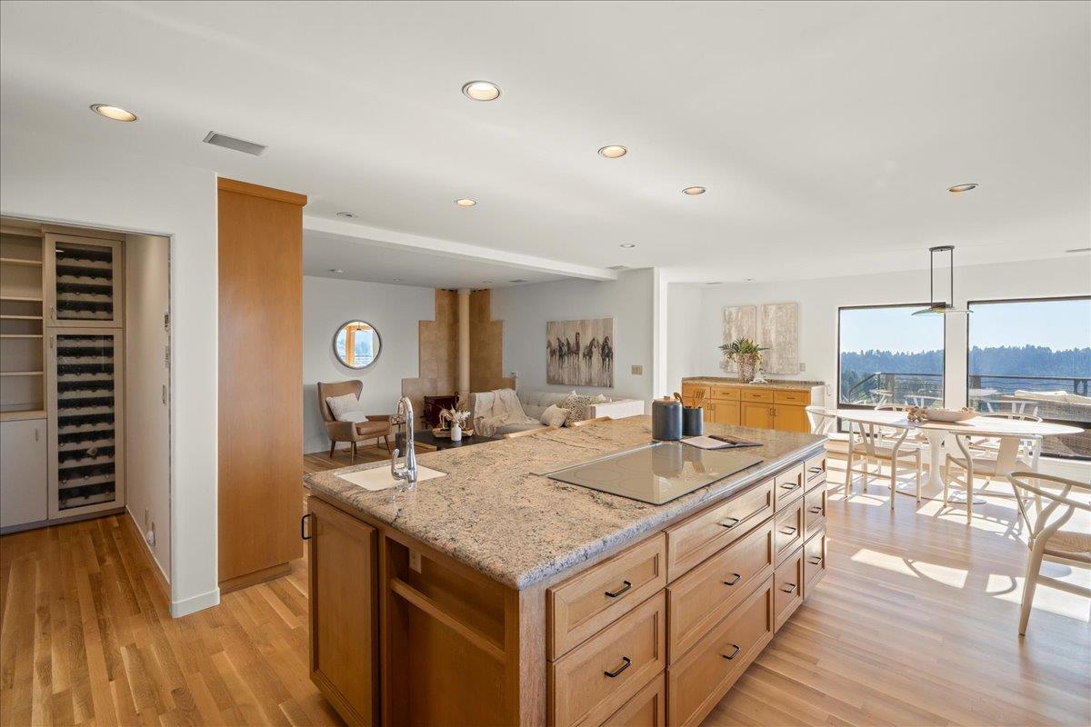 7 No Name Road Los Gatos, CA 95033 - Photo 15 of 49 a kitchen with granite countertop a sink stove and wooden floor