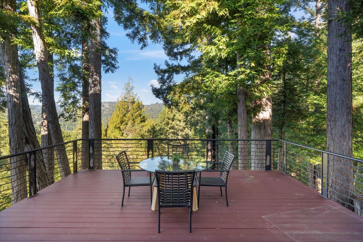 7 No Name Road Los Gatos, CA 95033 - Photo 24 of 49 a roof deck with table and chairs and wooden floor