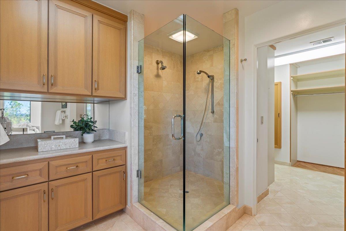 7 No Name Road Los Gatos, CA 95033 - Photo 30 of 49 a bathroom with a shower sink and cabinets