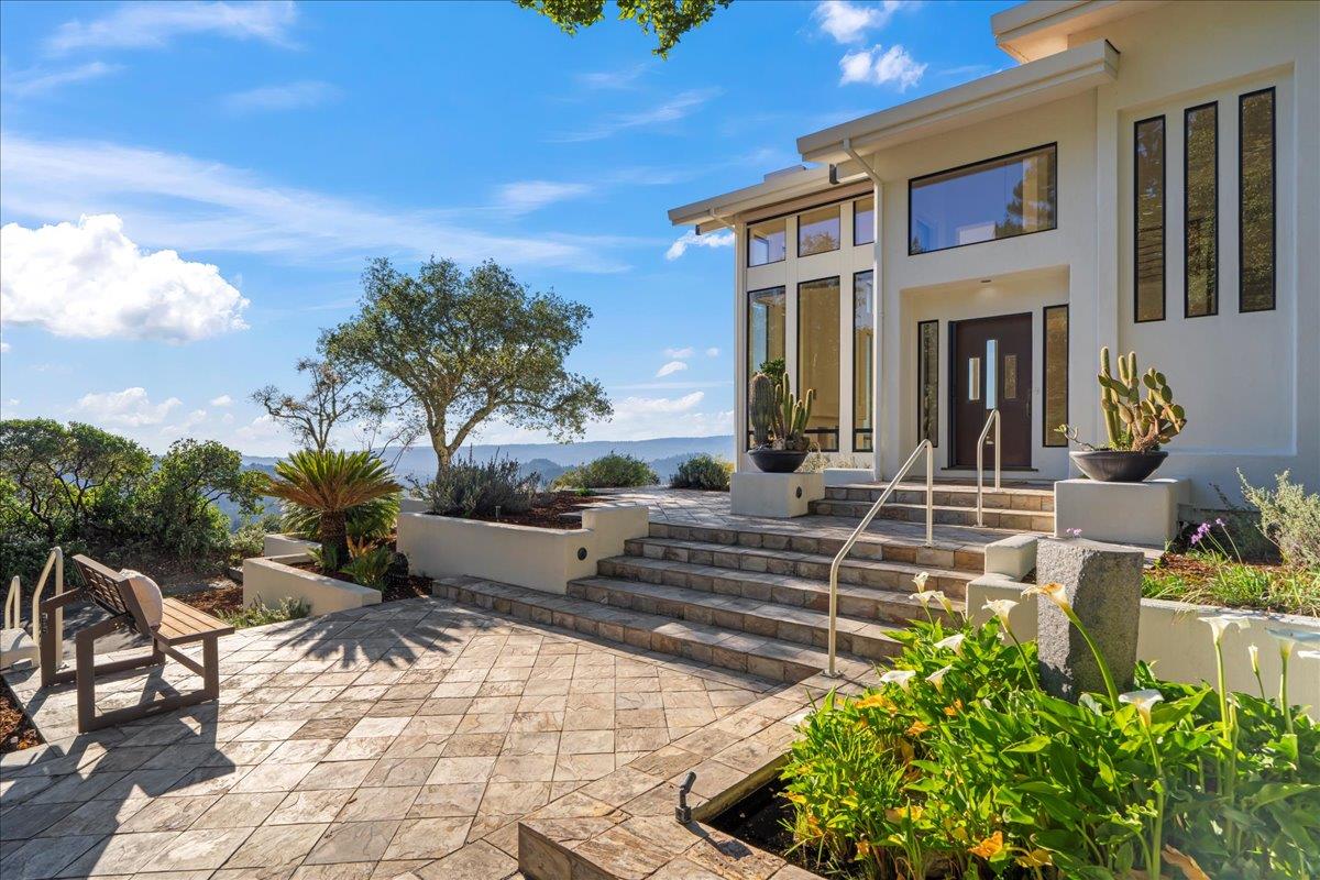 7 No Name Road Los Gatos, CA 95033 - Photo 5 of 49 a front view of a house with a yard