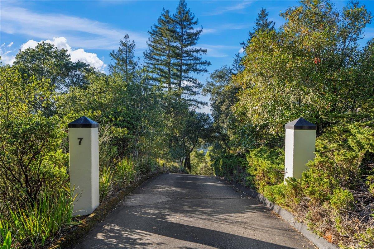 7 No Name Road Los Gatos, CA 95033 - Photo 8 of 49 a front view of a house with trees and plants