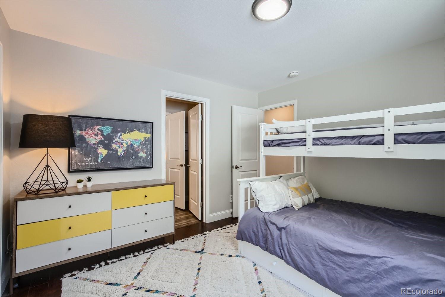 27732 Squaw Pass Road Evergreen, CO 80439 - Photo 11 of 33 a bedroom with a bed and furniture