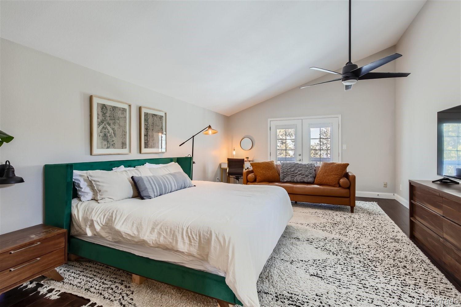 27732 Squaw Pass Road Evergreen, CO 80439 - Photo 13 of 33 a bedroom with a bed a couch and a dresser