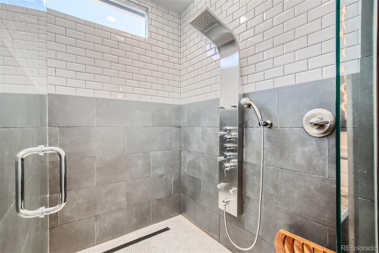 27732 Squaw Pass Road Evergreen, CO 80439 - Photo 15 of 33 a bathroom with a shower