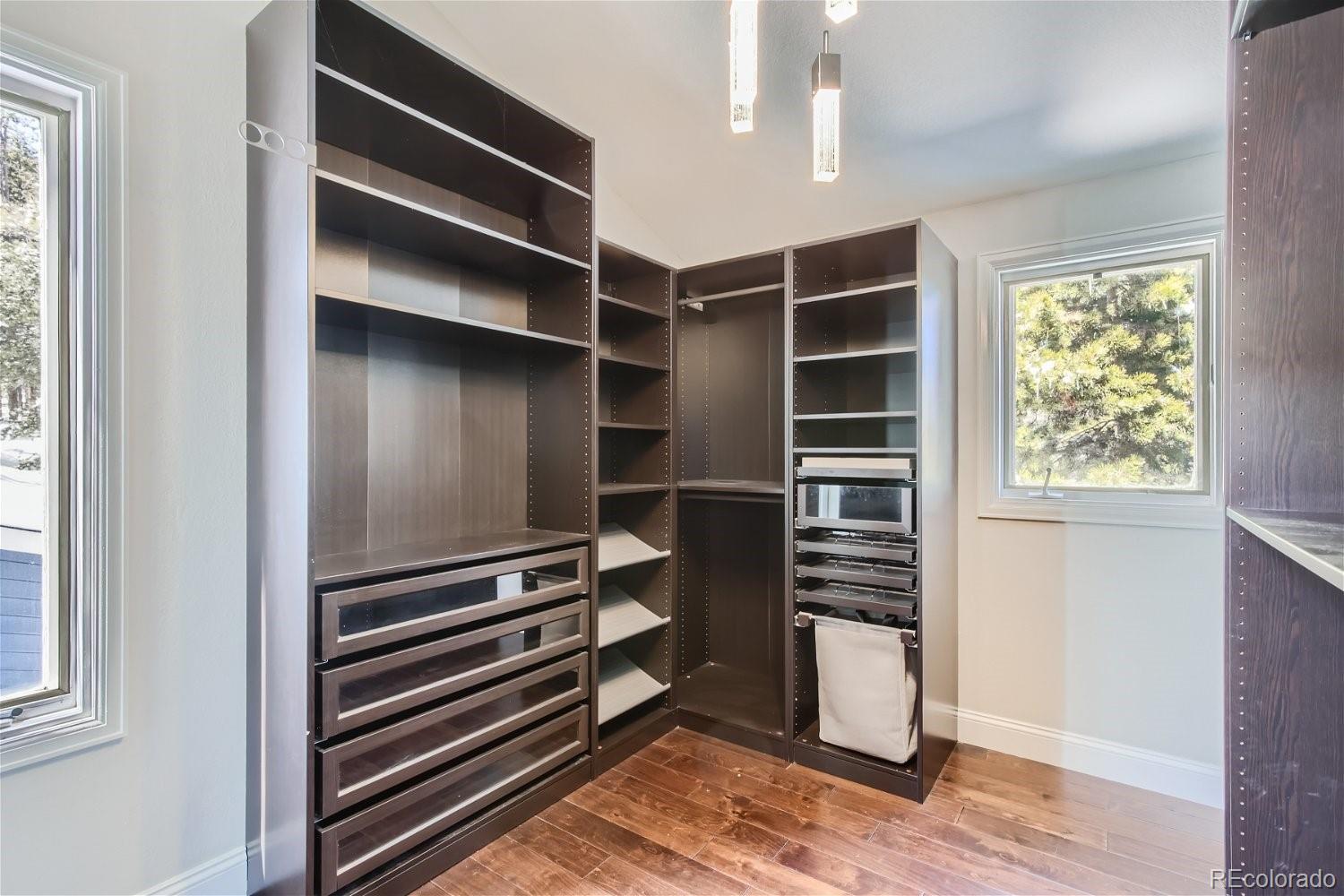 27732 Squaw Pass Road Evergreen, CO 80439 - Photo 17 of 33 a view of walk in closet with empty racks