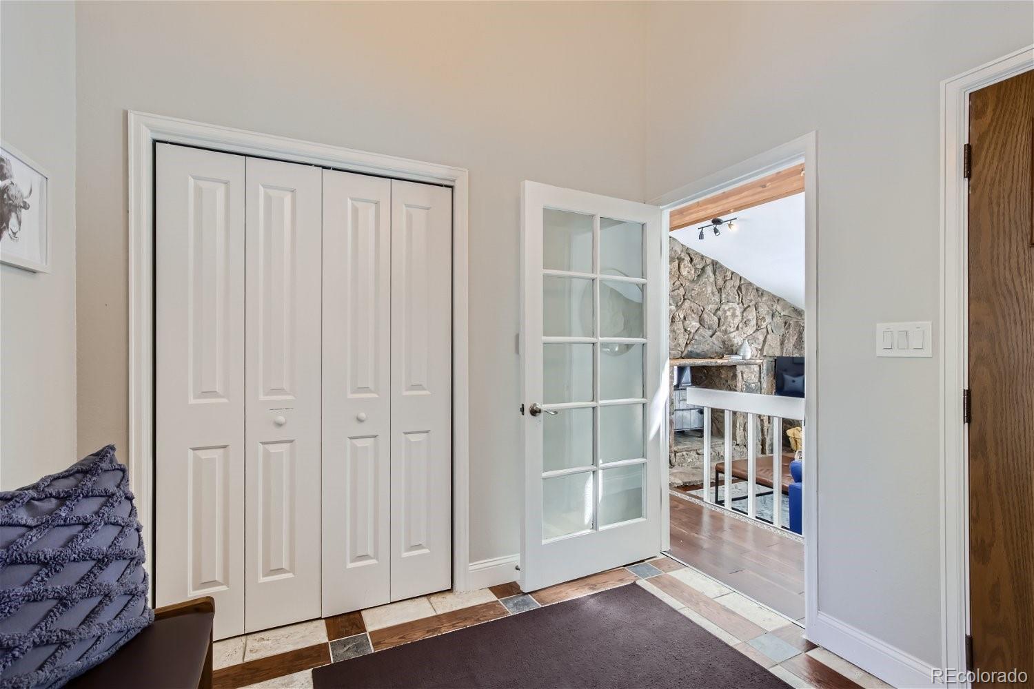 27732 Squaw Pass Road Evergreen, CO 80439 - Photo 21 of 33 an empty room with windows