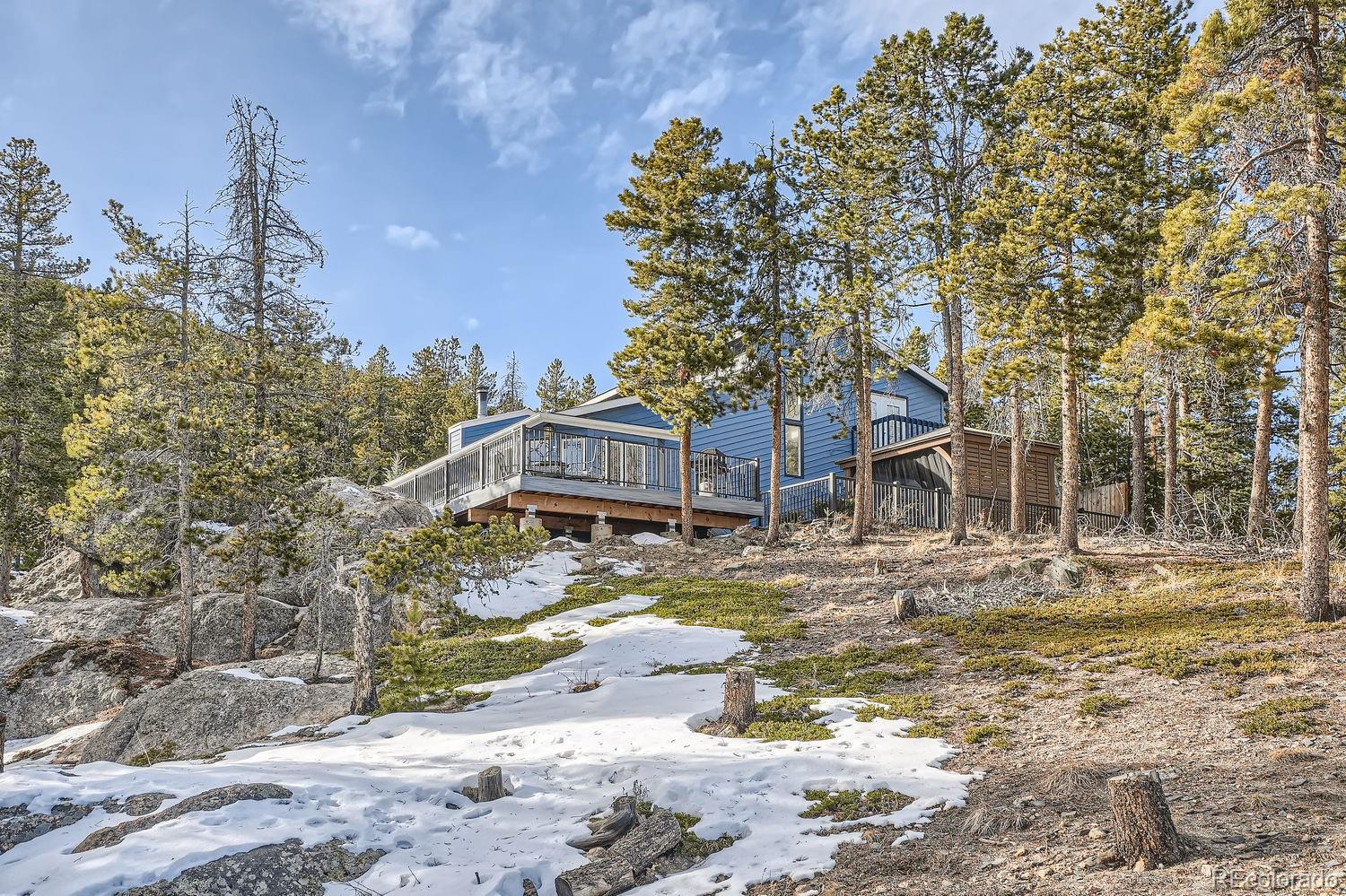 27732 Squaw Pass Road Evergreen, CO 80439 - Photo 25 of 33 a view of a house with a yard